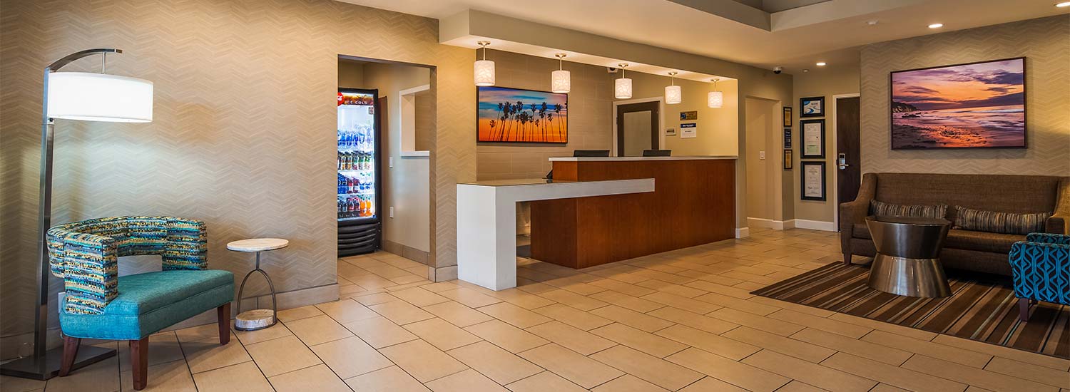 Entrance Lobby and Front Desk with door to Sundries Shop and lounge waiting area
